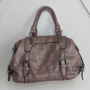 Woman’s buckled handbag